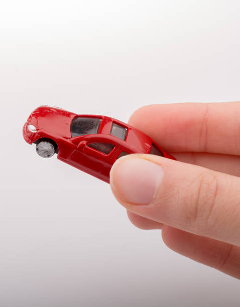 istock Colorful little toy car in hand 1028184866