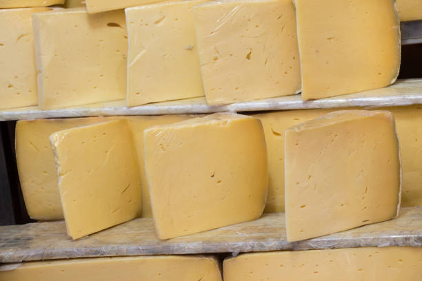 cuts of kashkaval or kasseri  cheese for sale on the shelf