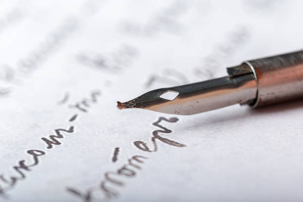 istock Fountain pen on an antique handwritten letter 1028187872