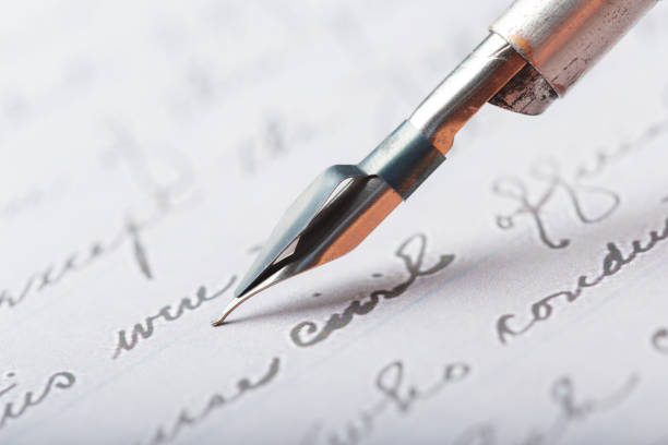 istock Fountain pen on an antique handwritten letter 1028189164