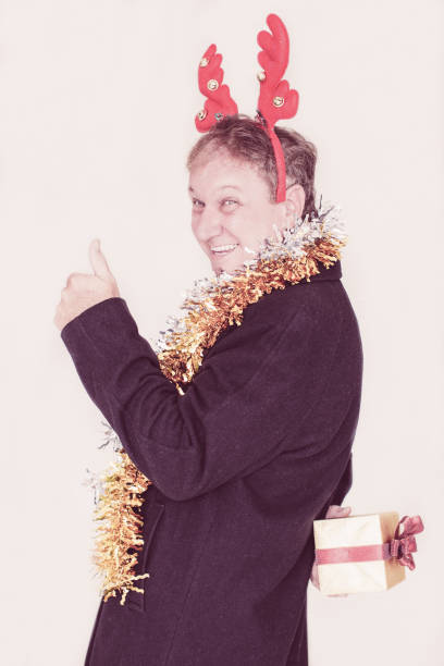 istock Laughing man planning to give Christmas gift 1028193642