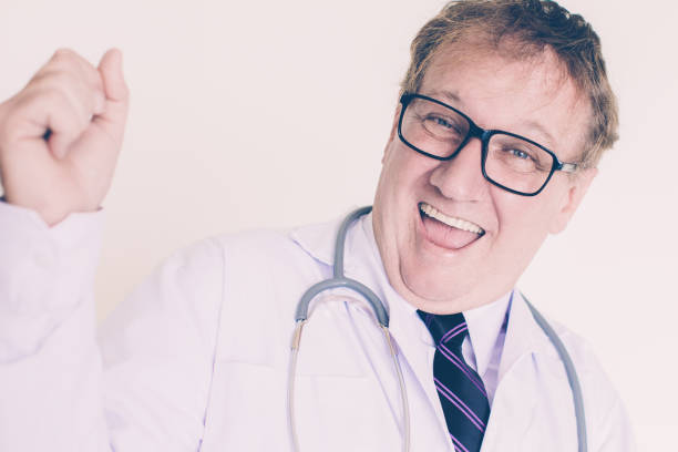 istock Cheerful Mature Doctor Celebrating Success 1028193744