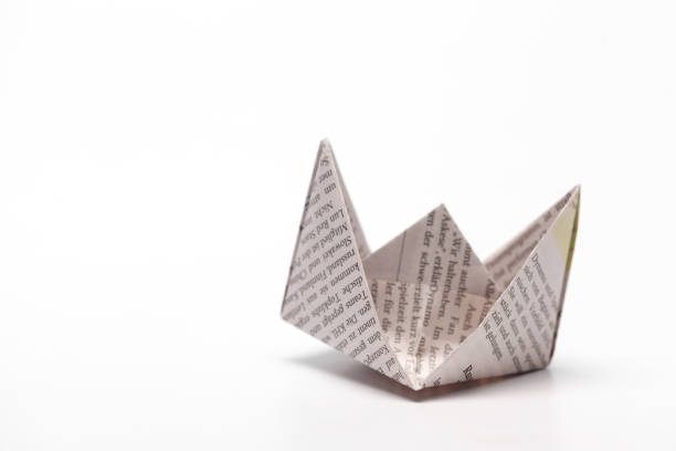 istock Origami paper boat isolated on white background 1028195094