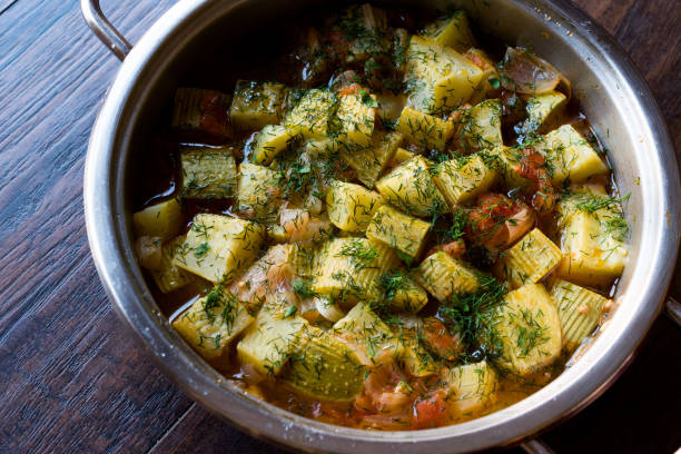 Turkish Casserole Food Zucchini with Dill and Tomatoes in Pan.