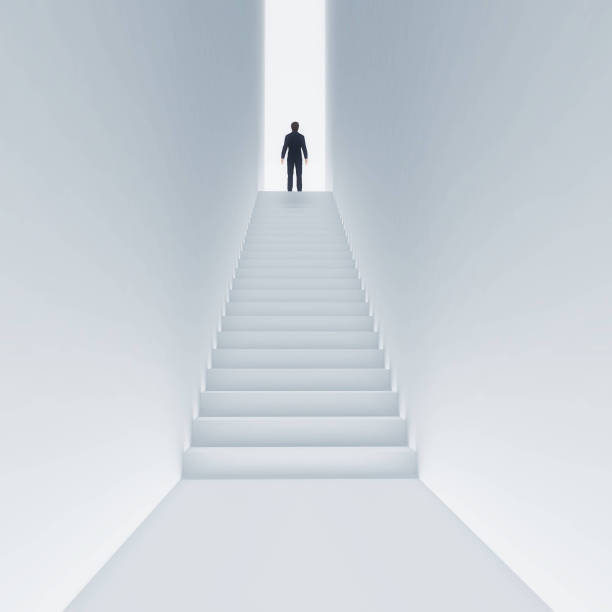 istock Young man climbing stairs to the sky 1028200624