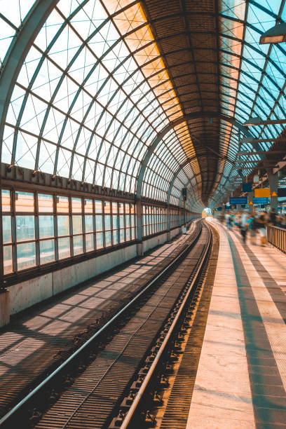 istock modern and curved train station with blurred traveler 1028203492