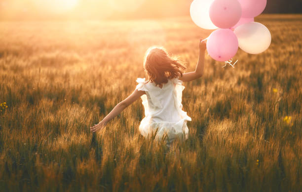 istock Girl running on cereal field 1028203582