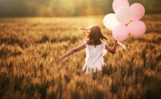 istock Girl running on cereal field 1028203616