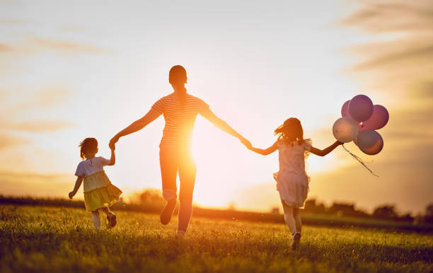 istock family playing outdoor 1028203632