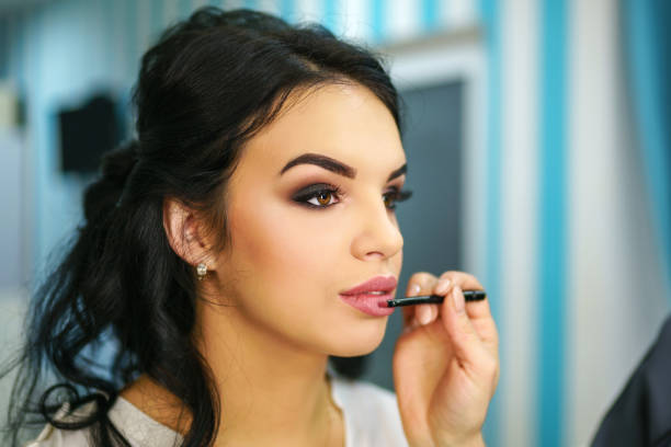 istock Beautiful bride on the makeup 1028220212