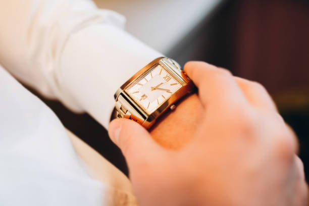 istock Male looking on the watch on his hand 1028220378