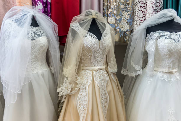 istock Amazing wedding dresses on mannequins in salon 1028224366