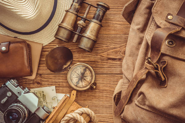 istock Looking image of travelling concept, essential vacation items. Backpack. Retro effect. 1028224622
