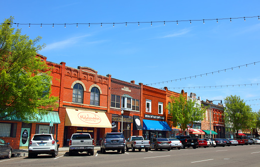Norman, Oklahoma, USA - April 24, 2018: Daytime view of the quaint and historic Main Street in the downtown district in the third-largest city in Oklahoma