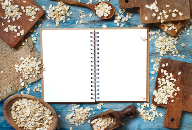 istock Rolled oats with a wooden spoon top view 1028228558