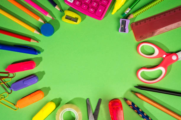 istock green background with a pencils, calculator, ruler and felt-tip pens 1028229142