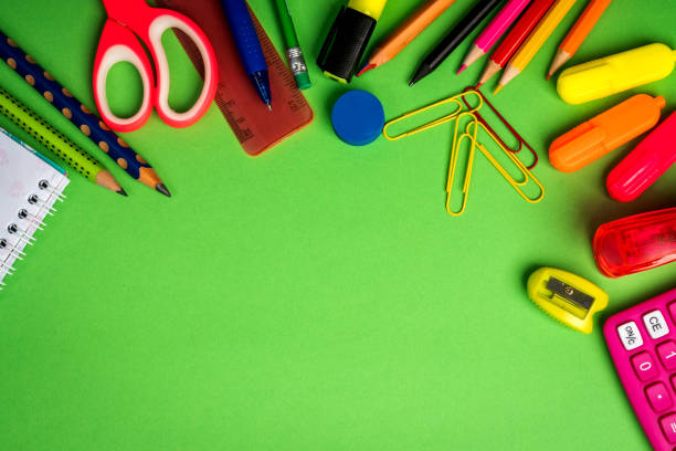 istock green background with a pencils, calculator, ruler and felt-tip pens 1028229158