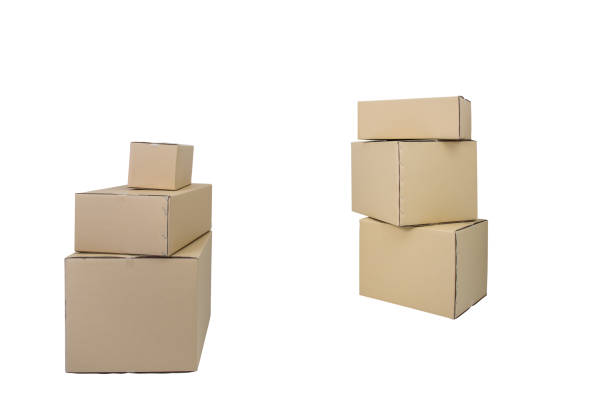 istock Cardboard Boxes in different sizes stacked boxes isolated on white backgrouns 1028229334