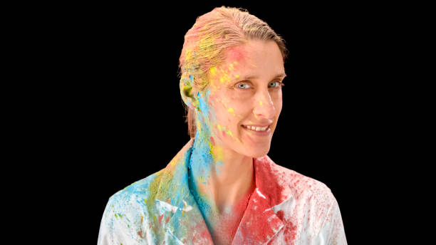 istock Woman sprayed by colourful powder 1028243640