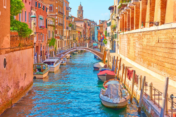 istock Canal with moored motorboats in Venice 1028253772