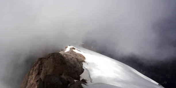 istock Alone at the top of Mount Marmolada, Italy 1028253804