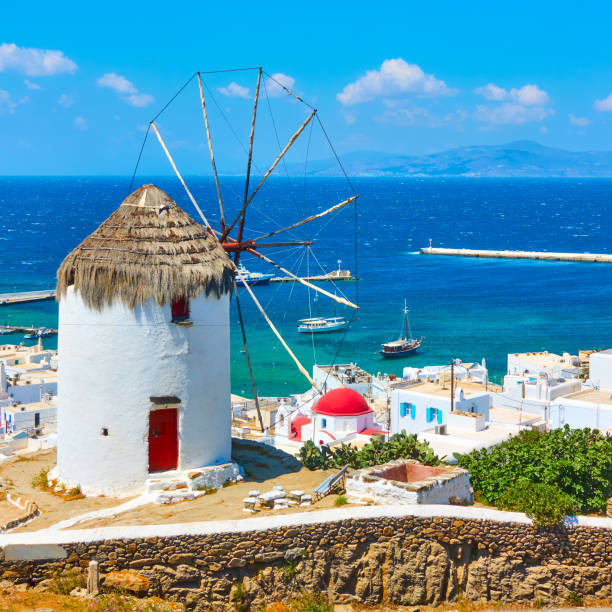 White greek windmilll with straw roof in Mykonos Island, Cyclades, Greece