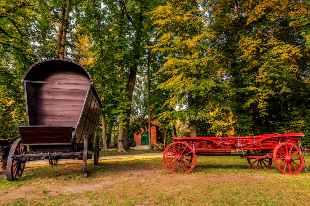 Two Chuck Wagons in the Garden Two Chuck Wagons in Wilanow Garden chuck wagon stock pictures, royalty-free photos & images