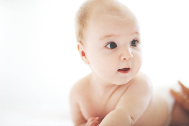 istock Cute adorable baby on bed 1028255892