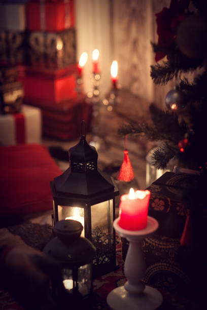 istock Christmas gifts and candles in lanterns 1028255930
