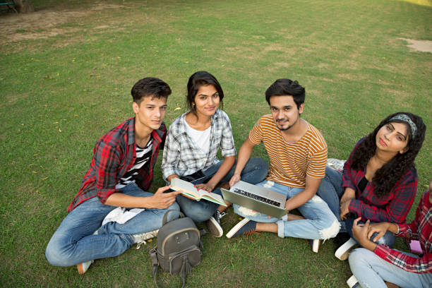 istock Team of Indian university students doing group study. - Stock image 1028263986