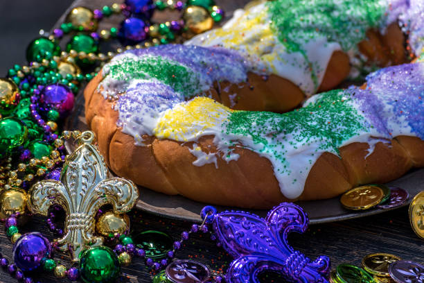 istock king cake surrounded by mardi gras decorations 1028266852