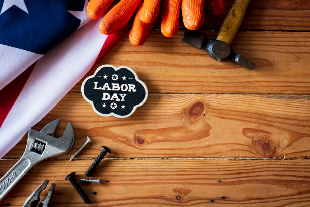 istock USA Labor day concept, First Monday in September. Different kinds on wrenches, handy tools, America flag and wooden tag on wooden table. 1028271156