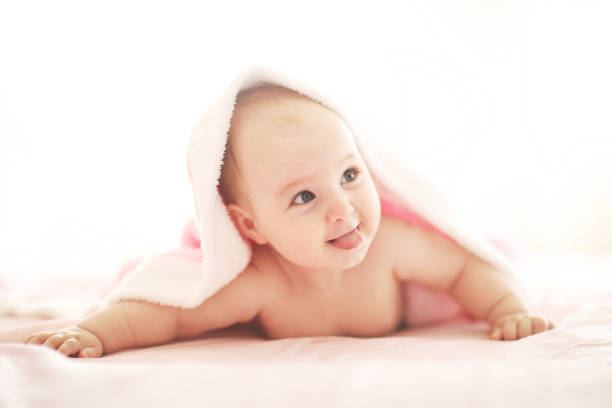 istock Cute adorable baby on bed 1028273162