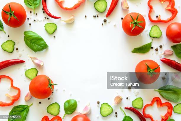 Colorful Salad Ingredients Pattern Made Of Tomatoes Pepper Chili Garlic Cucumber Slices And Basil On White Background Cooking Concept Top View Flat Lay Copy Space Stock Photo - Download Image Now