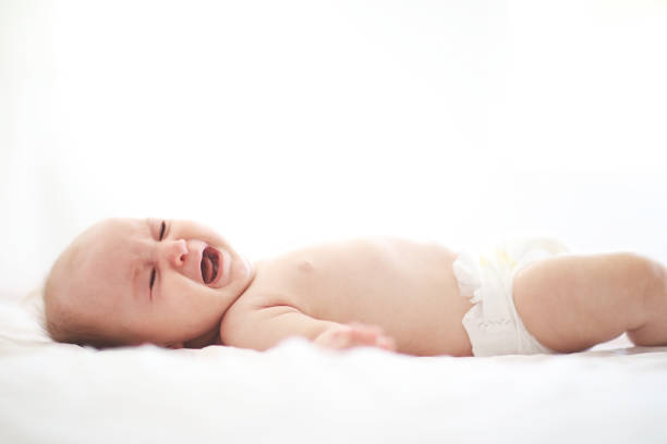 istock Cute adorable baby on bed 1028276568