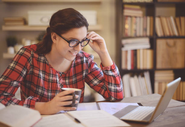 istock young woman working at home ( digital tablet and coffee) 1028290758