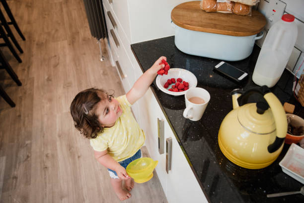 istock Little Girl Reaching for Fruit 1028301568