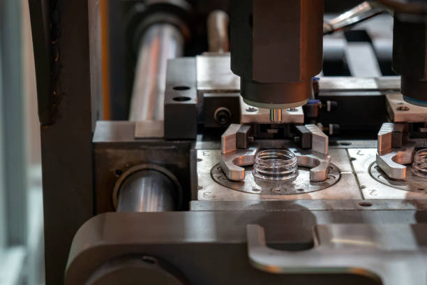istock The  preform shape in the blowing mold  for plastic bottles manufacturing process at the drinking factory. 1028302388