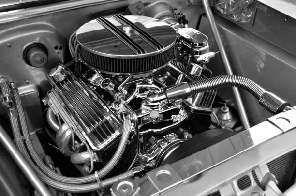 Restored car engine displayed at auto show in black and white showing much detail