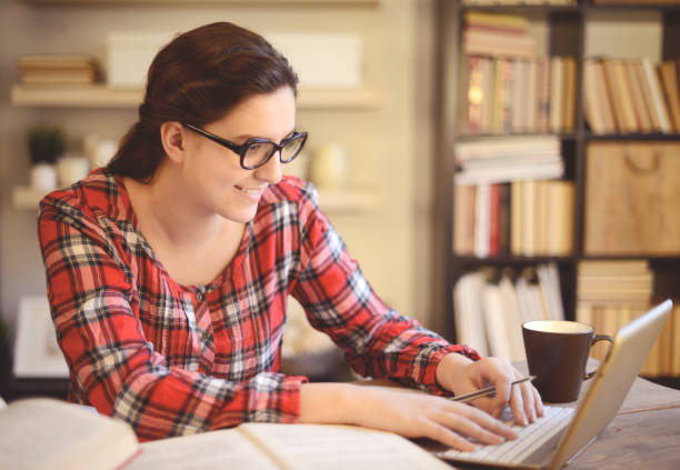 istock young woman working at home ( digital tablet and coffee) 1028306290