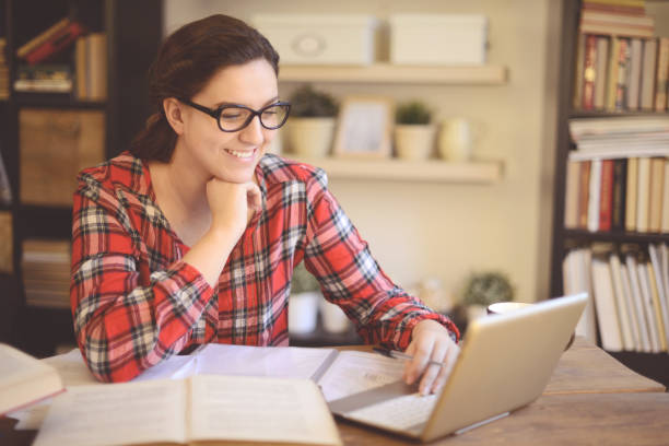 istock young woman working at home ( digital tablet and coffee) 1028309796