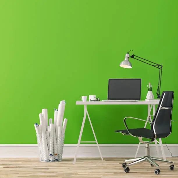 Workdesk with decoration on hardwood floor in front of empty green wall with copy space. 3D rendered image.