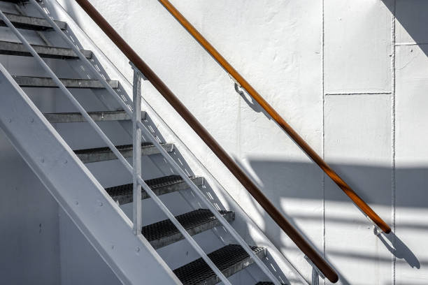 White steel staircase on old cruise ship. Beautiful shadows.