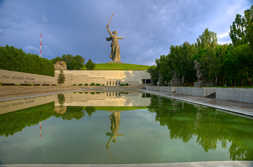 Russia, Volgograd - August, 2018: Sunset. Sculpture Homeland-Mother Calls! - compositional center of monument-ensemble to Heroes of Battle of Stalingrad on Mamayev Kurgan. Editorial use only