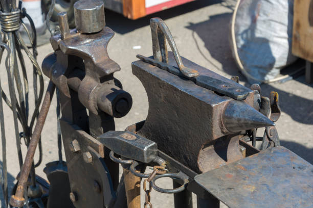 istock The workplace of the blacksmith - an anvil, a hammer, a vice. 1028319284