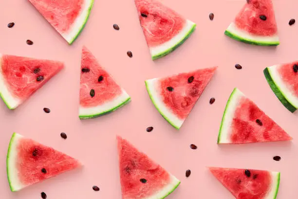 Photo of Watermelon slices pattern viewed from above. Top view. Summer concept.