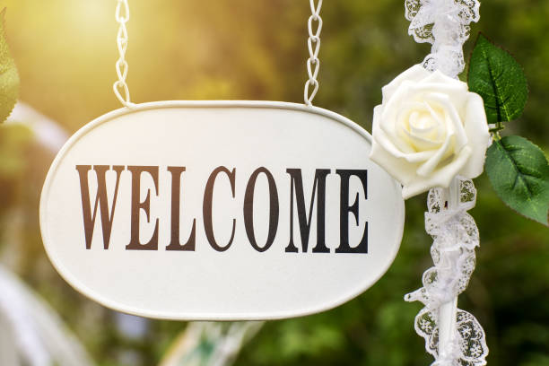 istock Welcome sign with white rose flower 1028327958