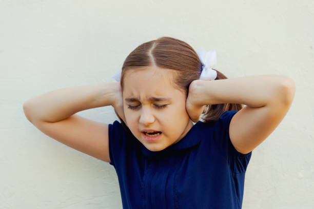 istock baby girl closes her ears 1028330652