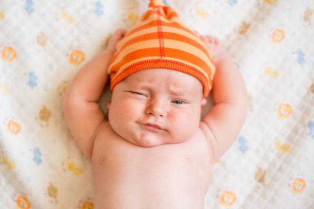 istock sweet little baby looking at camera 1028339498