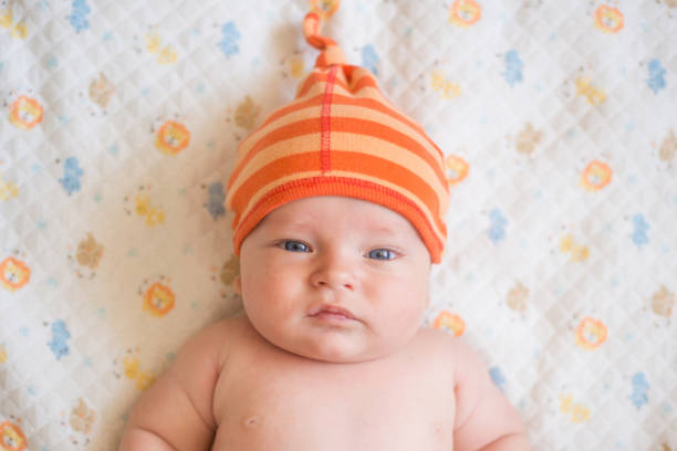 istock sweet little baby looking at camera 1028339798